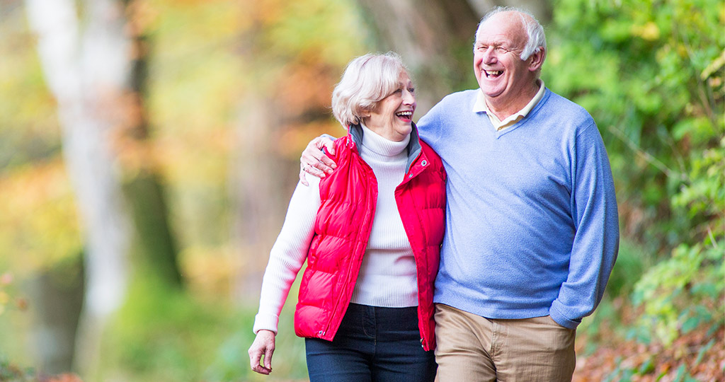 Resolutions blog header featuring senior couple going for outdoor walk