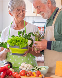 Senior couple preparing healthy meal together